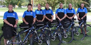 Image of NPD bike patrol standing with their bikes
